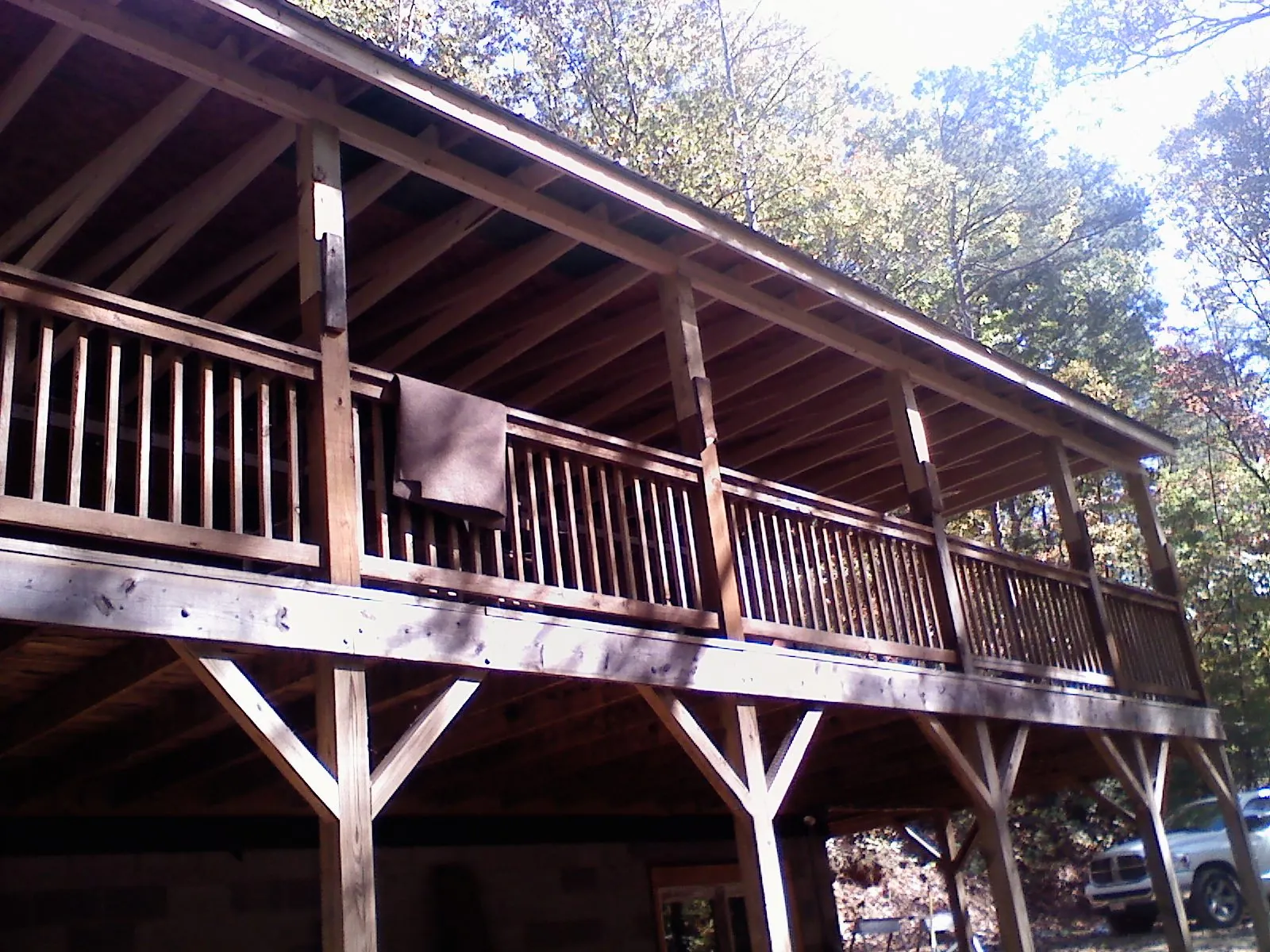 Timber framing under a new elevated porch and deck — Roof Leak Repair in Grand Haven by Roofing Brothers